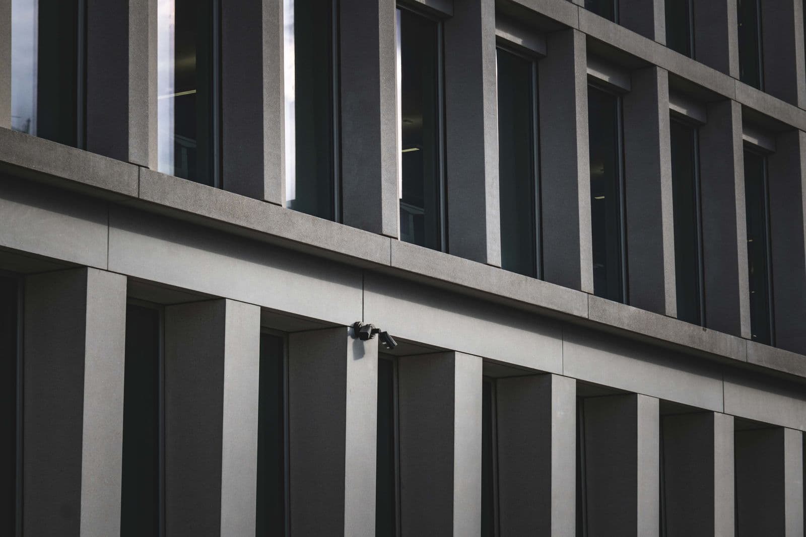 Modern building facade in grey light